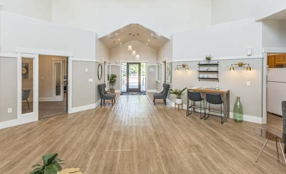 a living room with a dining room and a kitchen