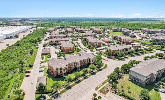 A bird's eye view of a residential area with multiple apartment buildings.