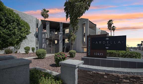 The image shows a modern building with a sign that reads "ARDELLA 12435".