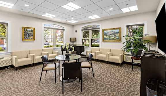 a conference room with couches and a table in the center of the room