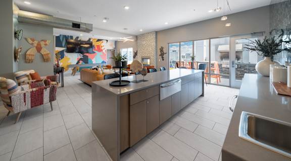 a view of the kitchen and living room in the clubhouse at the bradley braddock