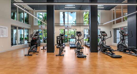 Spacious Fitness Center Overlooking Pool Area