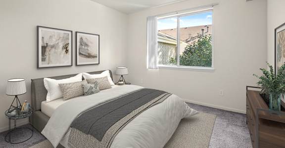 A bedroom with a large bed and two framed pictures on the wall.