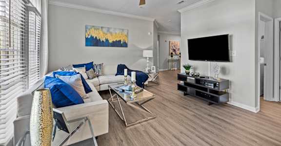 a living room with a couch and a tv