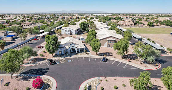 an aerial view of a neighborhood with houses and a parking lot