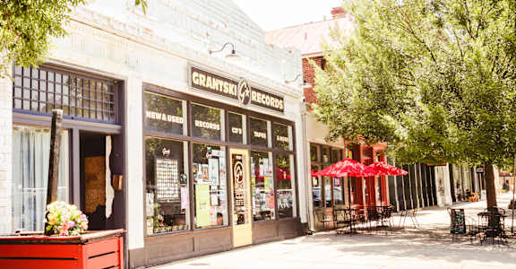 a street view of a coffee shop on a city street  at Canalside, Augusta, GA