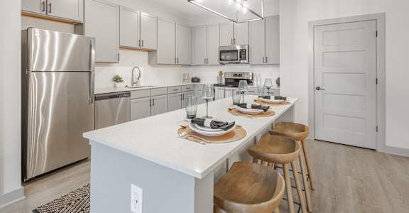 Modern kitchen with a white countertop and stainless steel appliances at Arbour Place Apartments, Indiana