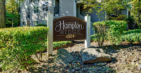 a sign in front of a house that reads