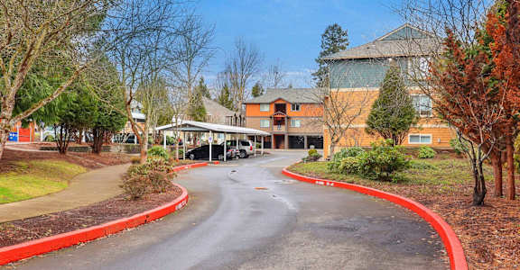 A curved road leads to a building with a red border.