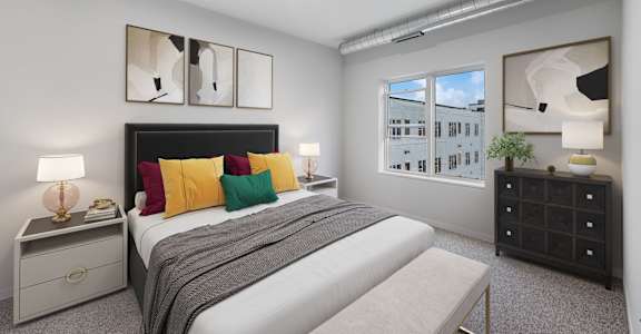 a bedroom with a bed and a window