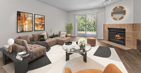 A modern living room with a fireplace and a glass coffee table.