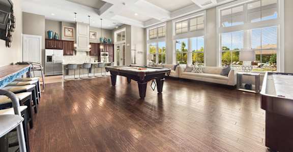 a large living room with a pool table in the middle at The Ridge at Chenal Valley, Little Rock, Arkansas