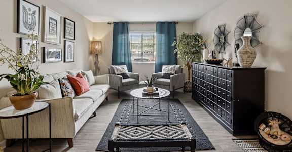 Living room with white sofa and natural light at The Brentwood, Nashville, 37211