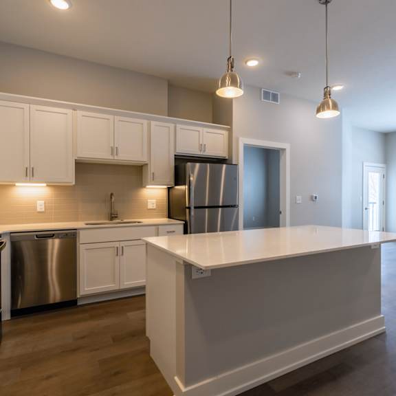 Gourmet open concept kitchen at Newton Place Apartments in Haslett, MI