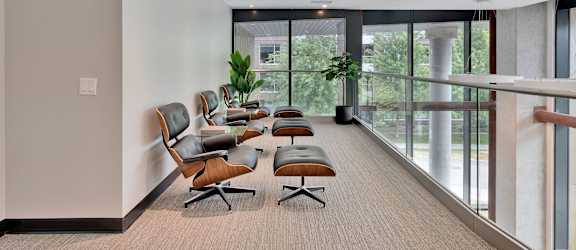 A conference room with a long table and chairs.