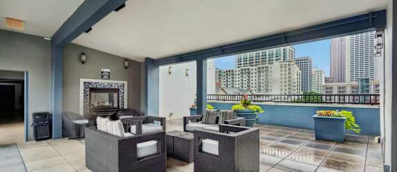 A patio with two couches and a table.