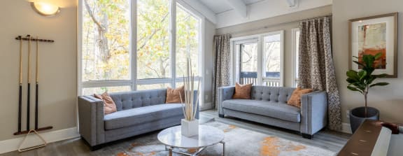 a living room with furniture and a ceiling fan at Tucker Square, Stone Mountain, GA