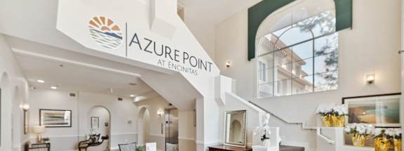 the living room and dining room of a zuber point apartments home