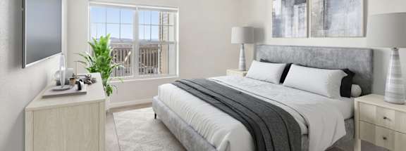 a bedroom with a bed and a window