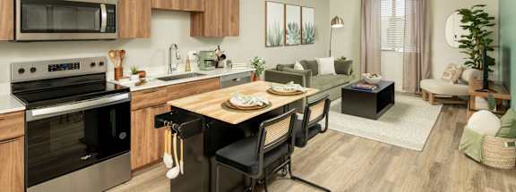 A modern kitchen with wooden cabinets and stainless steel appliances.