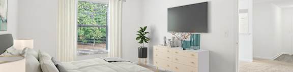 A bedroom with a large bed and a flat screen TV mounted on the wall.