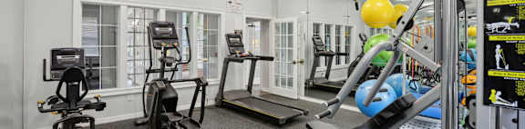 A well-equipped gym with various exercise machines and equipment.