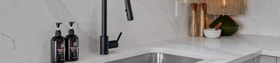 a kitchen sink with a window over it