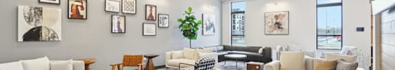 A spacious living room with a variety of furniture and decorative items.