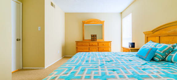 Forest Lake at Oyster Point Newport News VA Guest Bedroom interior with teal bedding