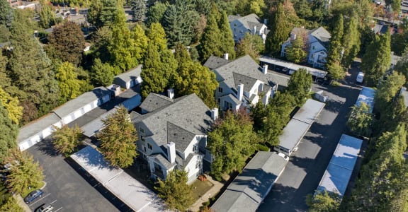 an aerial view of a neighborhood with houses and trees