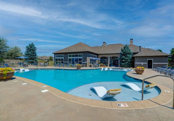 pool with lounge seating at Dakota Ridge Apartments in Littleton, CO 80127