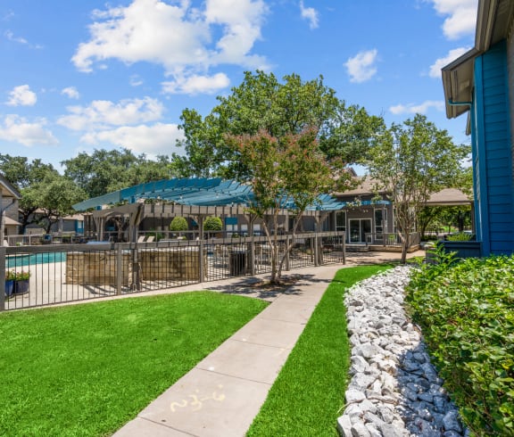 take a dip in the pool at the whispering winds apartments in pearland, tx