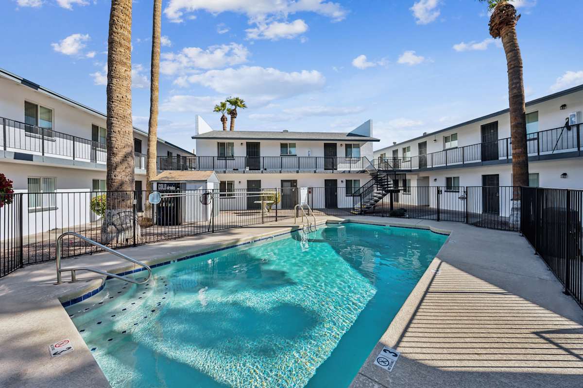 Pool and poolside area at Canberra Apartments.