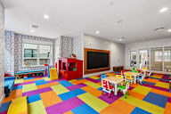 A colorful children's playroom with a variety of toys.