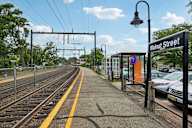 A train station with a sign that says Walnut Street.