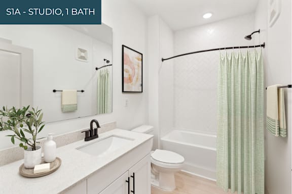 A bathroom with a white toilet and a white sink.