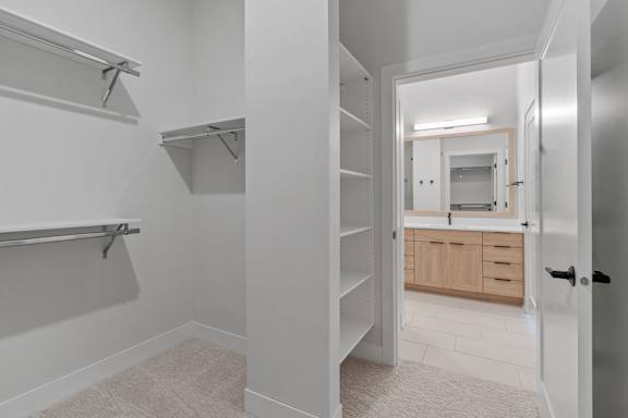 Walk-In Closet Leading To Bathroom