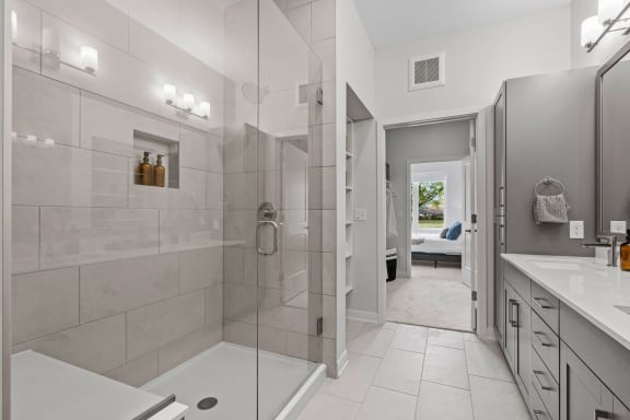 a bathroom with a shower and a sink