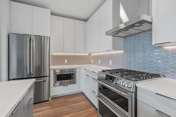 Kitchen with White Cabinetry and Stainless Steel Appliances