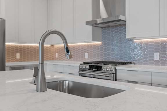 Kitchen with White Cabinetry and Stainless Steel Appliances
