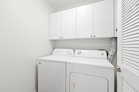 a laundry room with a washer and dryer