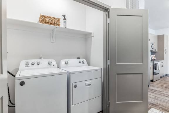 a white washer and dryer in a laundry room with a refrigerator at Prism at Diamond Ridge, Moon Township, PA, 15108