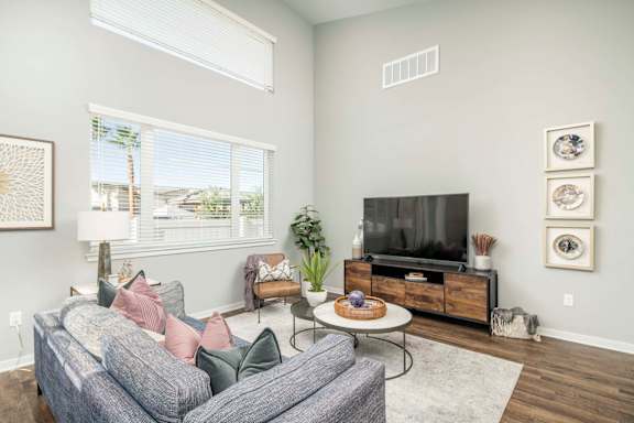 a living room with a couch and a tv at Grandstone at Sunrise, Peoria, AZ, 85383