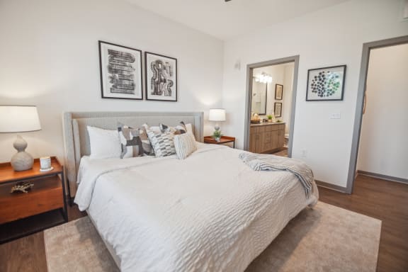 a bedroom with a large bed and a mirror  at Palm Grove, Ellenton, Florida