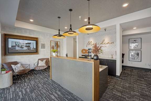 a lobby with a reception desk and a wall with a mural at CityPlace, Woodbury, MN 55125