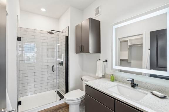 a bathroom with a shower and a sink and a toilet at Drift, Daytona Beach, FL, 32117