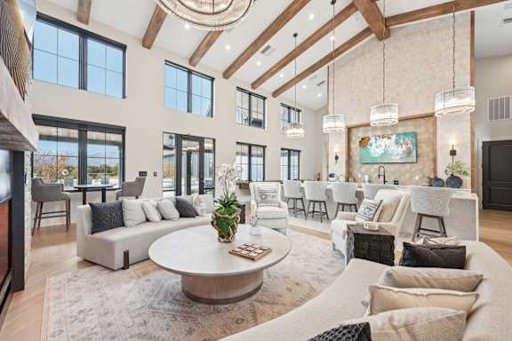 a living room with couches and chairs and a table at The Garrison Luxury Apartment Homes, Colorado