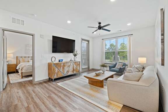 Living Room With Ceiling Fan at The Quinn Luxury Apartments, Pensacola, FL
