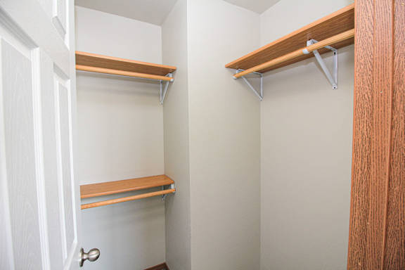 A white door is on the left and a brown door is on the right.
