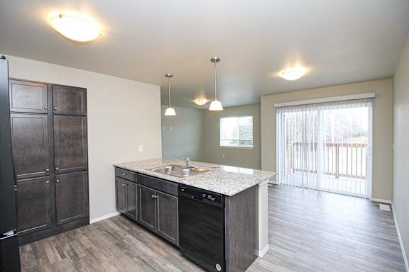 A kitchen with a sink and a counter top.